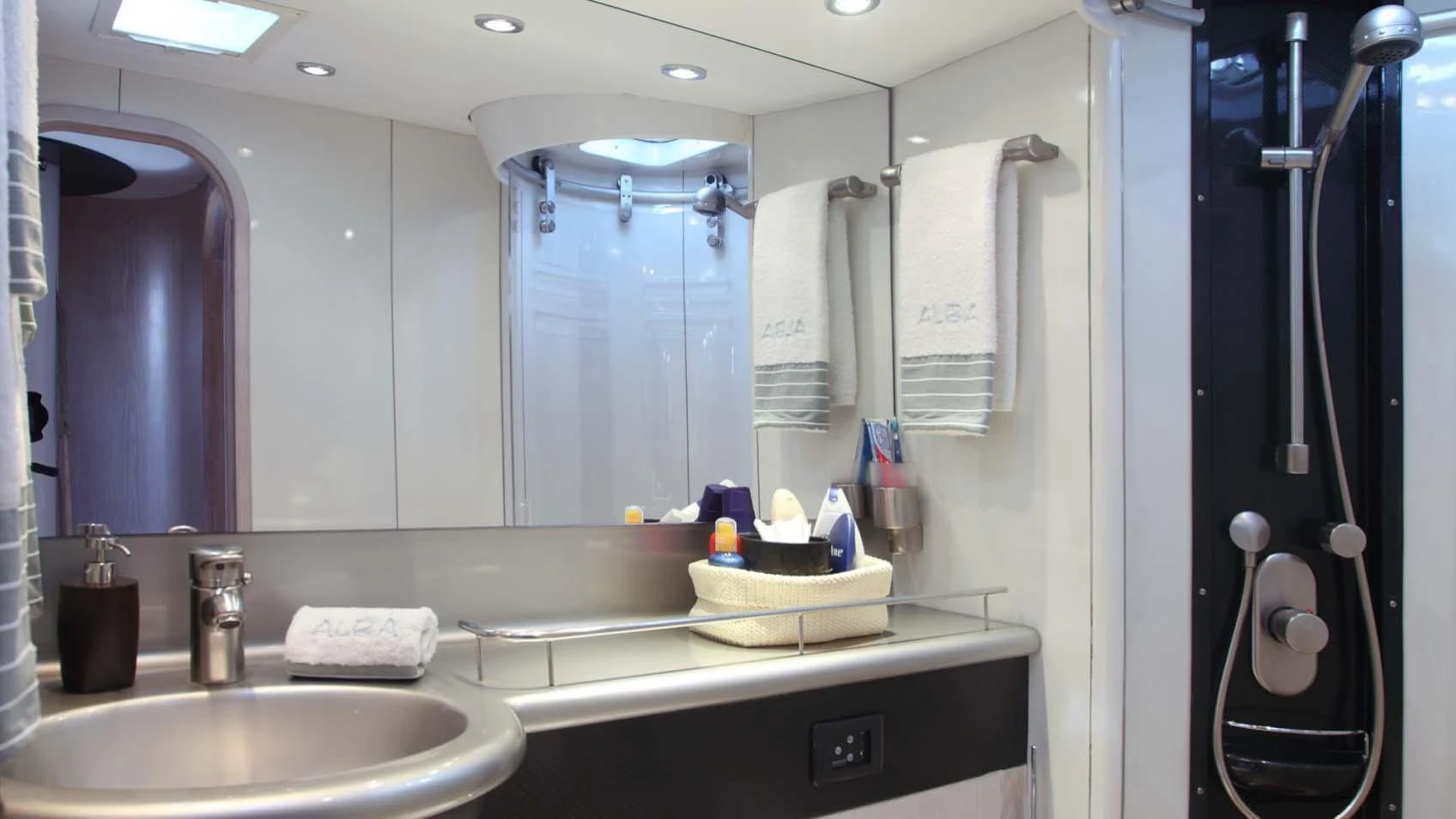 a bathroom with a large mirror aboard MARIA ALBA II Yacht for Sale