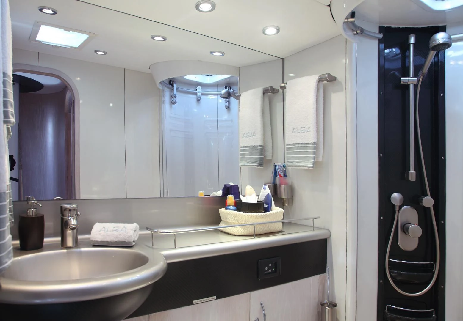 a bathroom with a large mirror aboard MARIA ALBA II Yacht for Sale