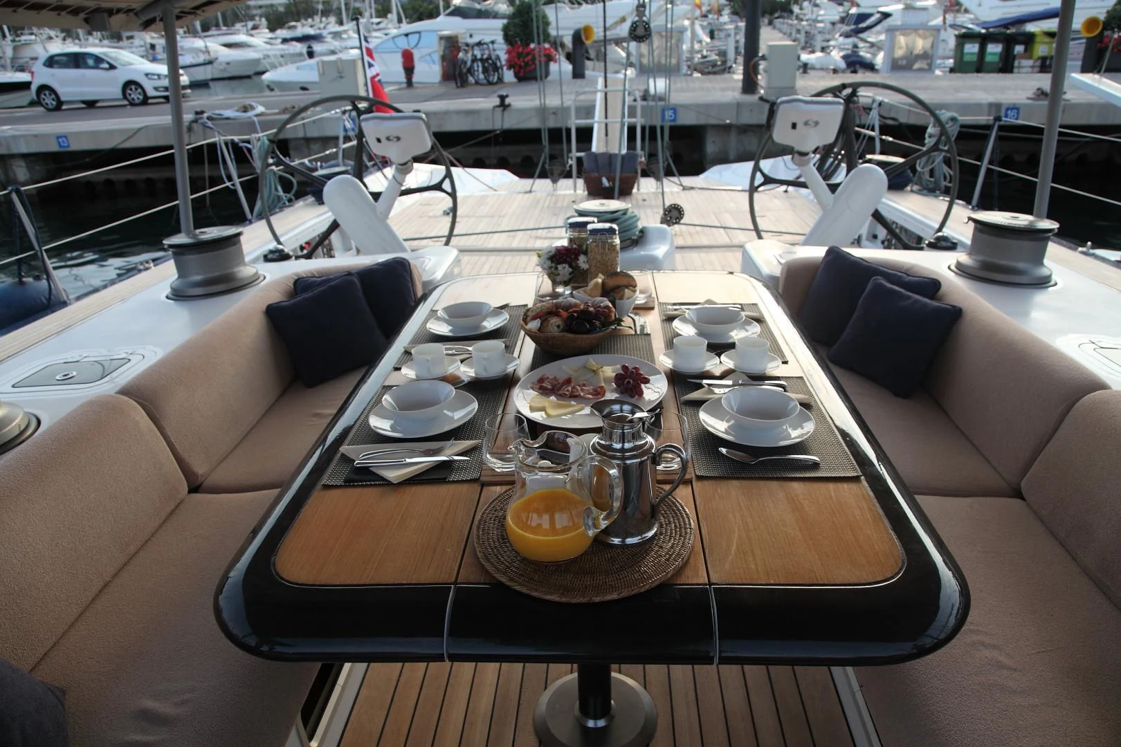 a table with plates and cups on it aboard MARIA ALBA II Yacht for Sale