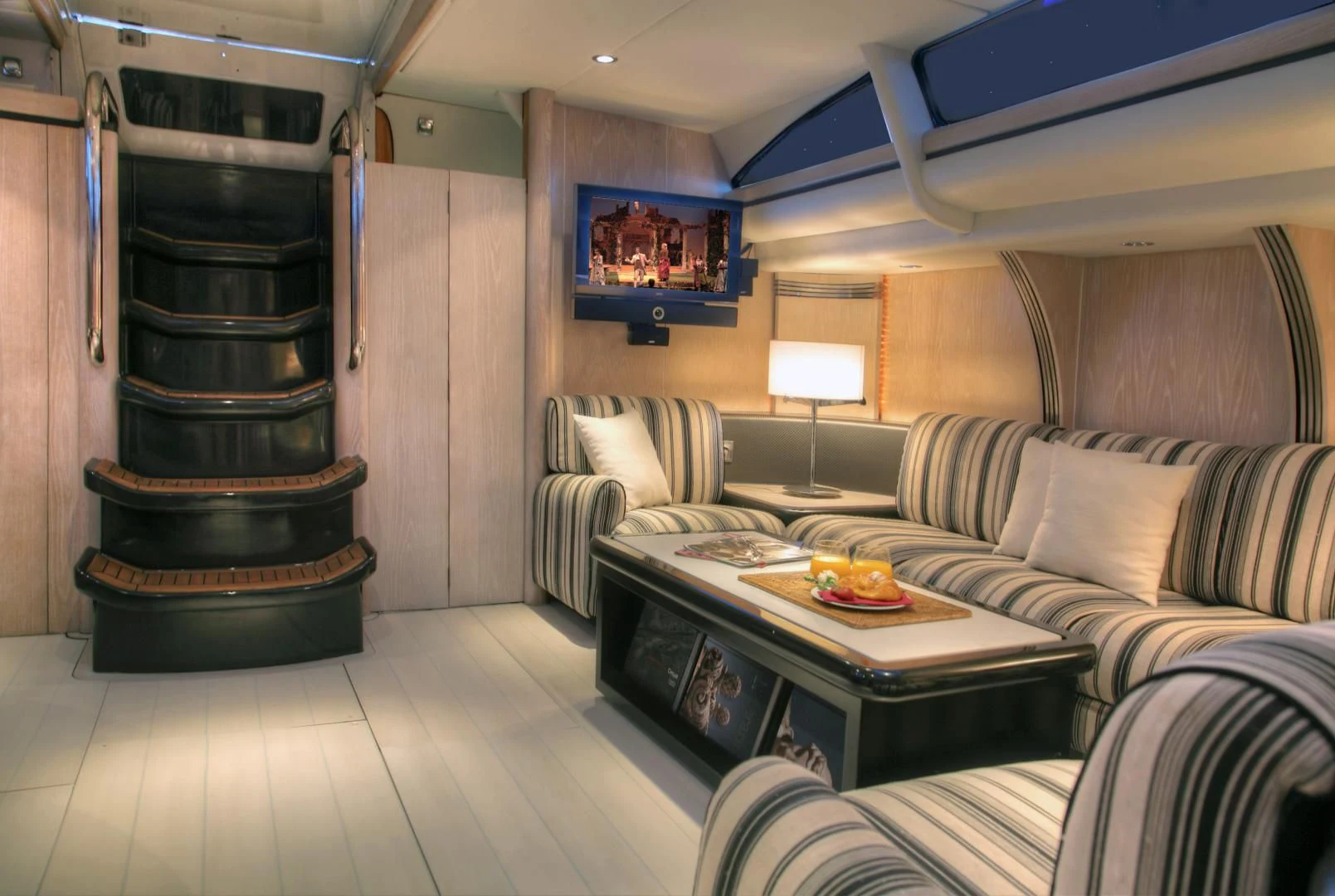 a living room with a fireplace aboard MARIA ALBA II Yacht for Sale