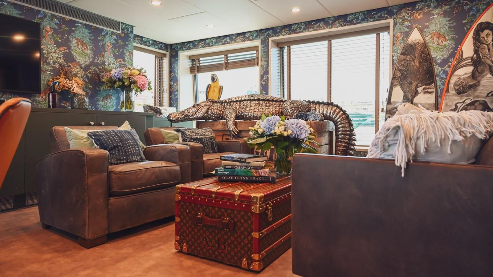 a living room with a large painting aboard BAD COMPANY SUPPORT Yacht for Charter