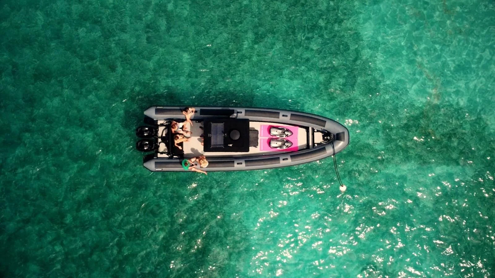 a toy gun on a green surface aboard BAD COMPANY SUPPORT Yacht for Charter