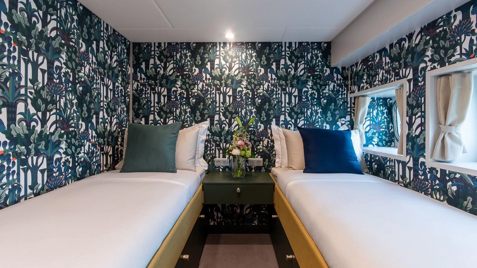 a bedroom with a bed and a desk aboard BAD COMPANY SUPPORT Yacht for Charter