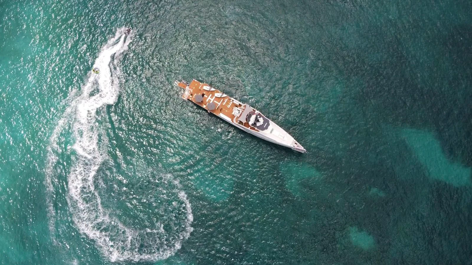 a small boat in the water aboard BAD COMPANY SUPPORT Yacht for Charter