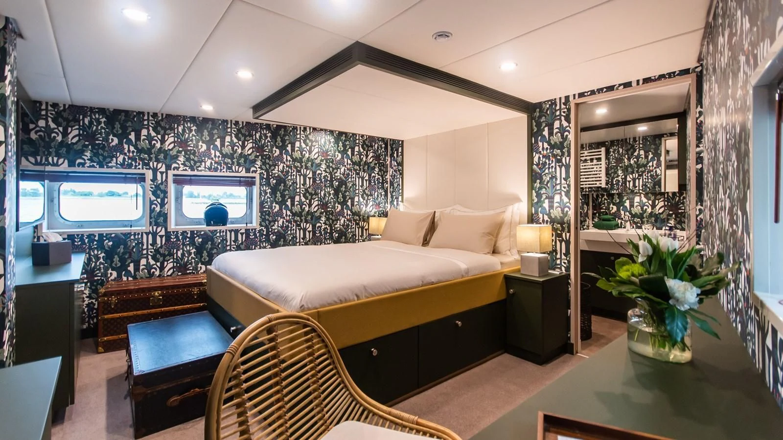 a large bedroom with a large bed aboard BAD COMPANY SUPPORT Yacht for Charter