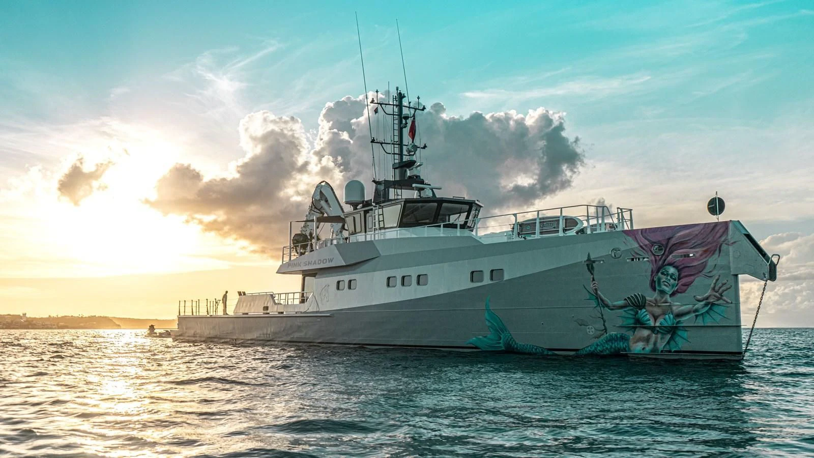 a large ship in the water aboard BAD COMPANY SUPPORT Yacht for Charter