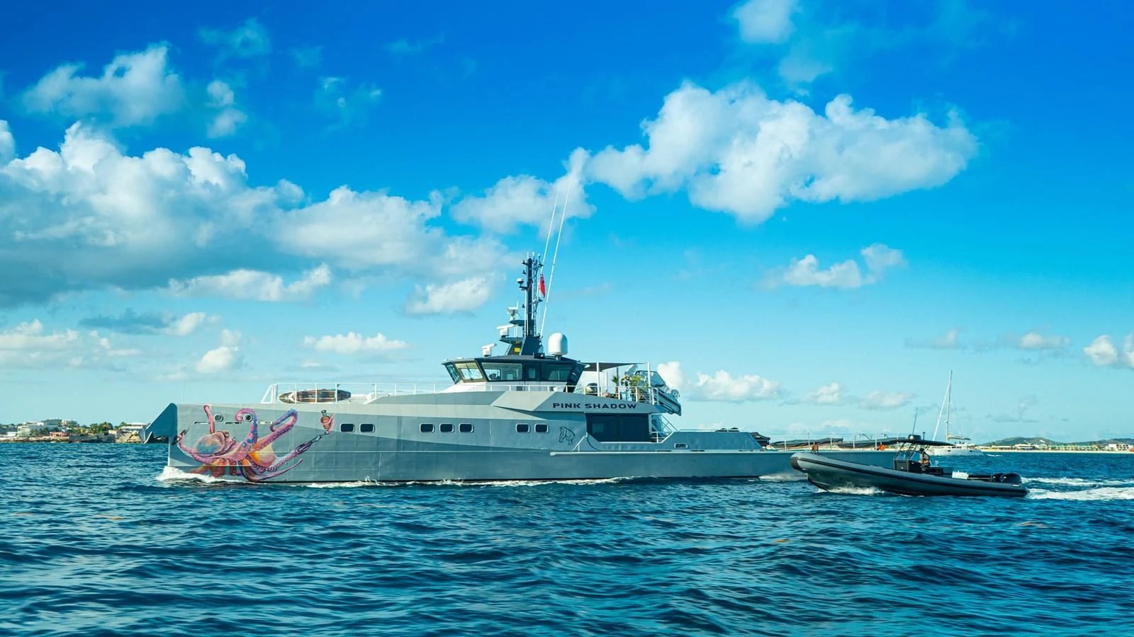 a large ship in the water aboard BAD COMPANY SUPPORT Yacht for Charter