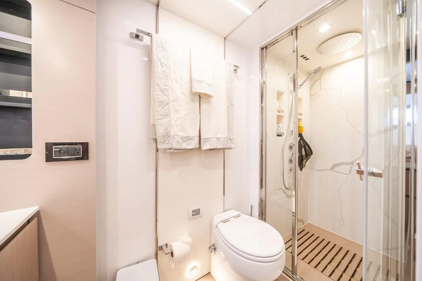 a bathroom with a glass shower aboard 2022 AZIMUT 72 FLYBRIDGE OUR TRADE Yacht for Sale
