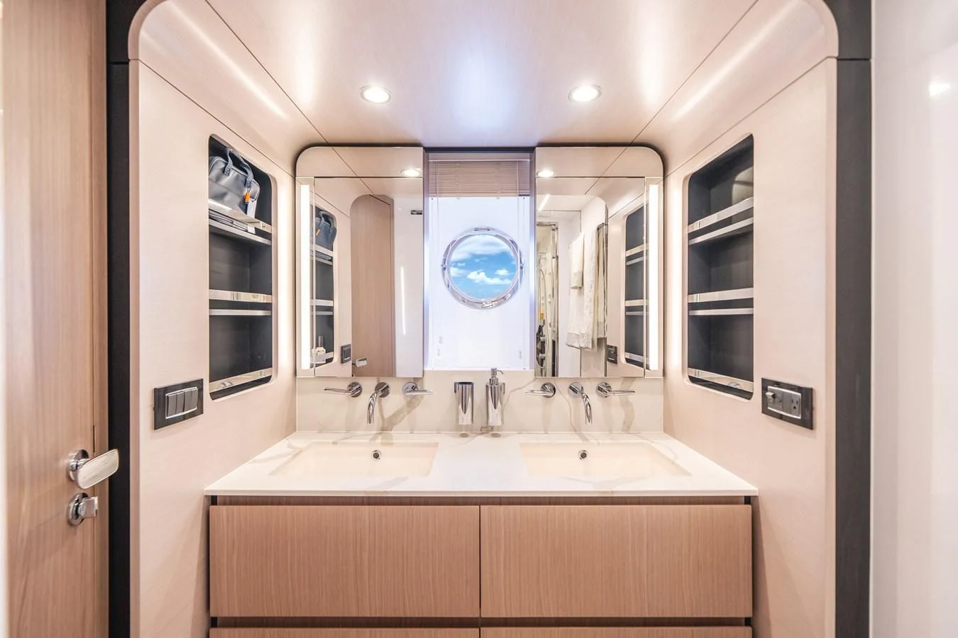 a bathroom with a large mirror aboard 2022 AZIMUT 72 FLYBRIDGE OUR TRADE Yacht for Sale