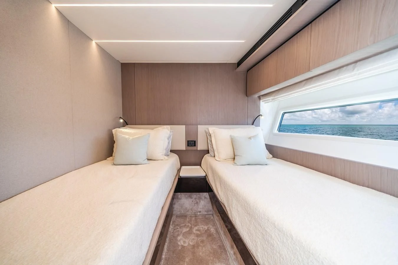 a room with two beds aboard 2022 AZIMUT 72 FLYBRIDGE OUR TRADE Yacht for Sale