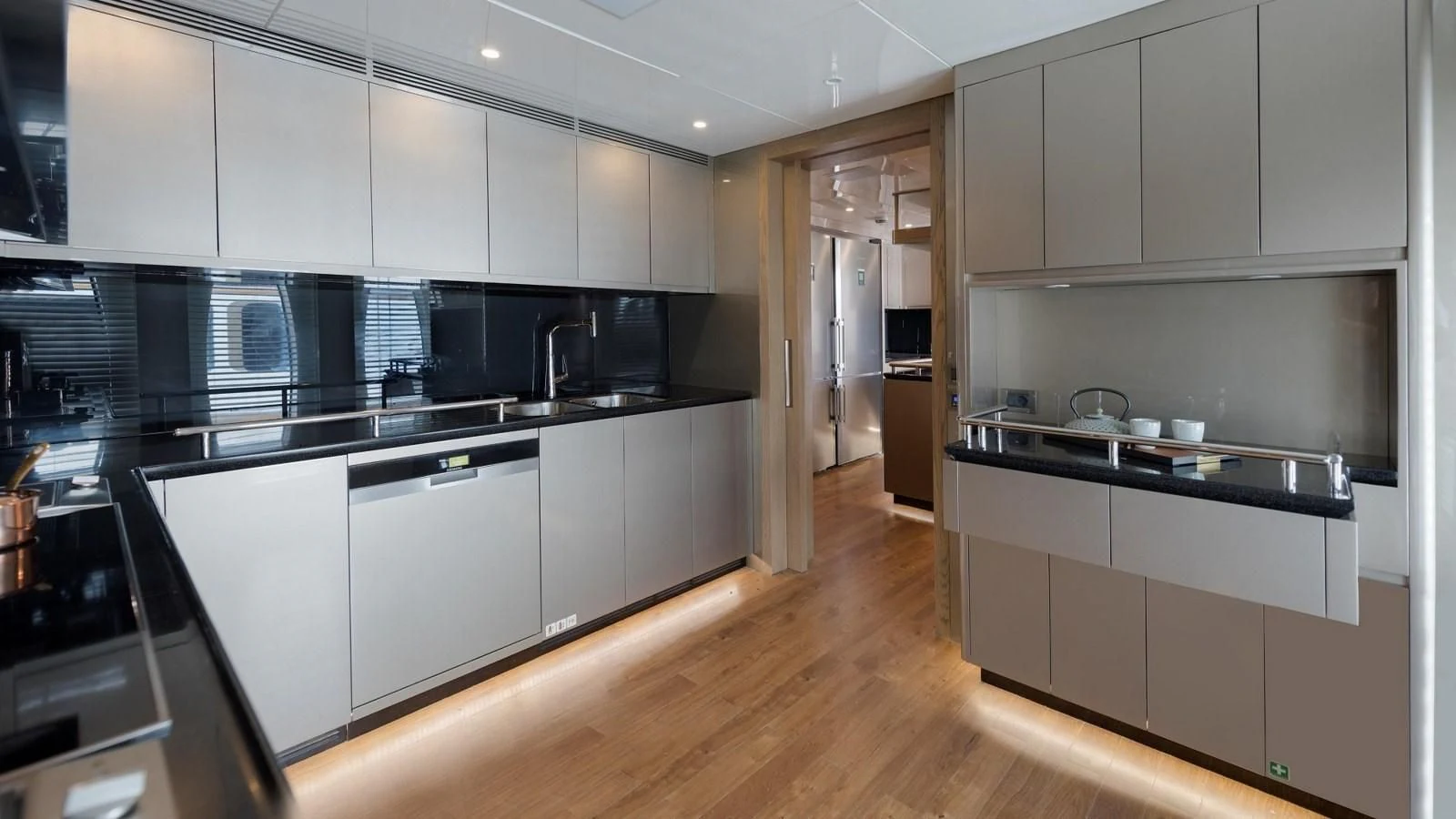 a kitchen with white cabinets aboard M 47 Yacht for Sale