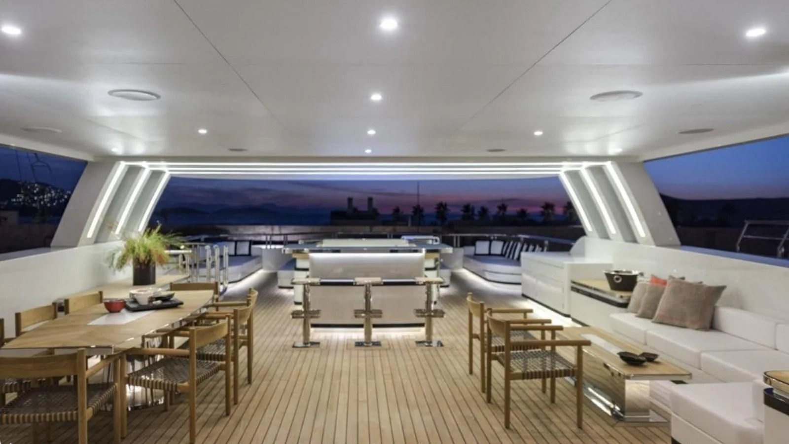 a room with tables and chairs aboard M 47 Yacht for Sale