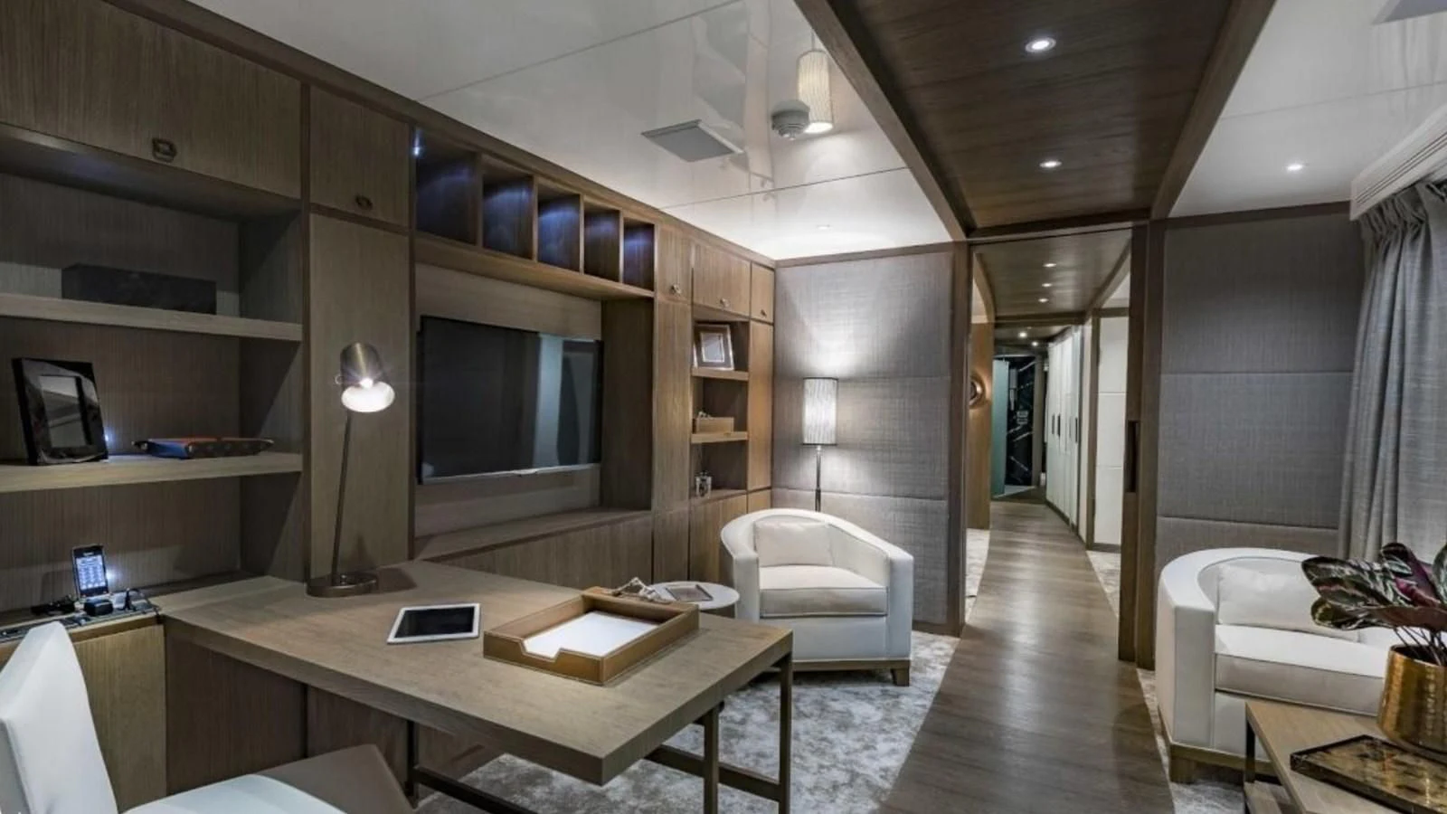 a room with a desk and a bed aboard M 47 Yacht for Sale