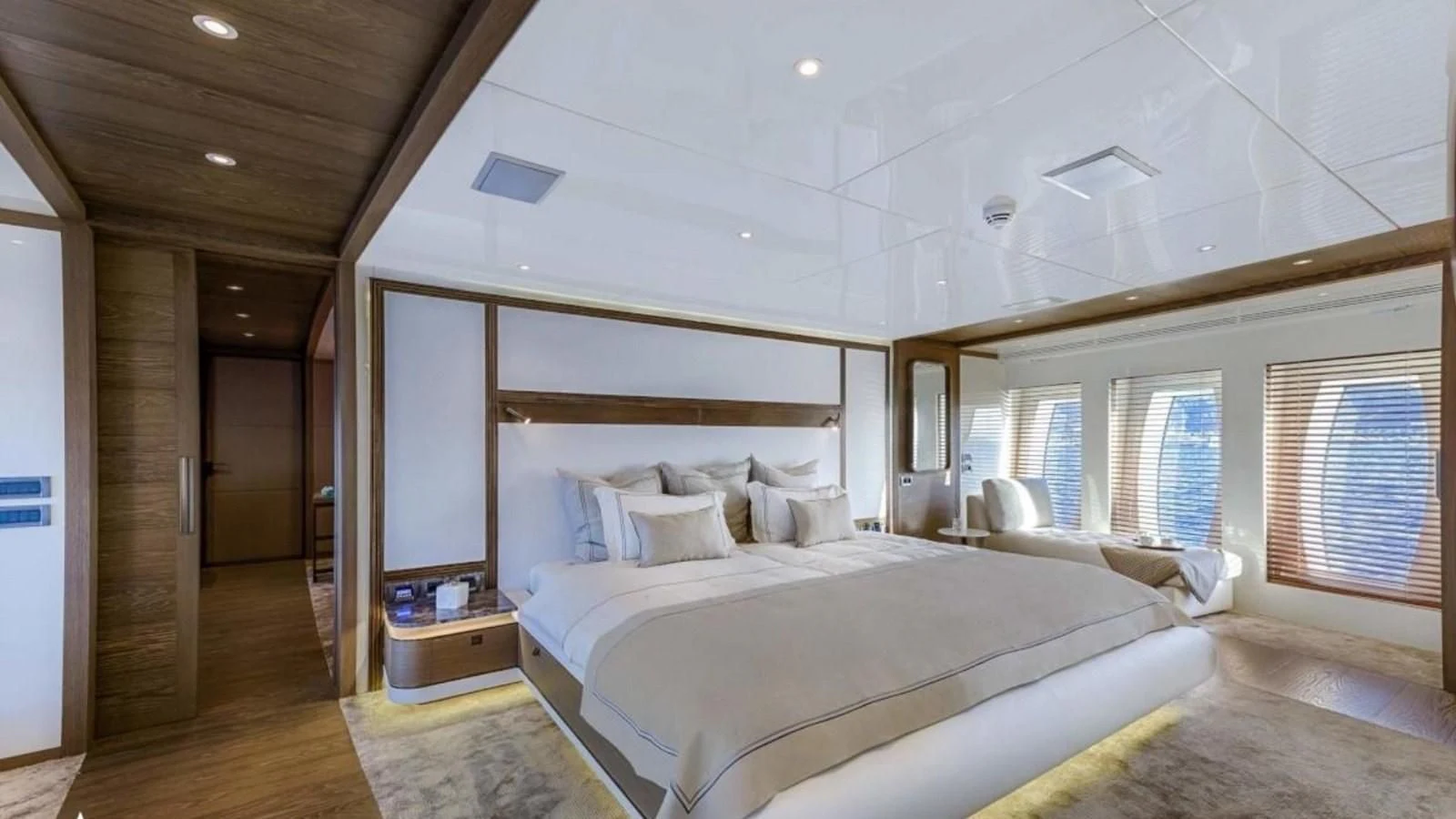 a room with a bed and a mirror aboard M 47 Yacht for Sale