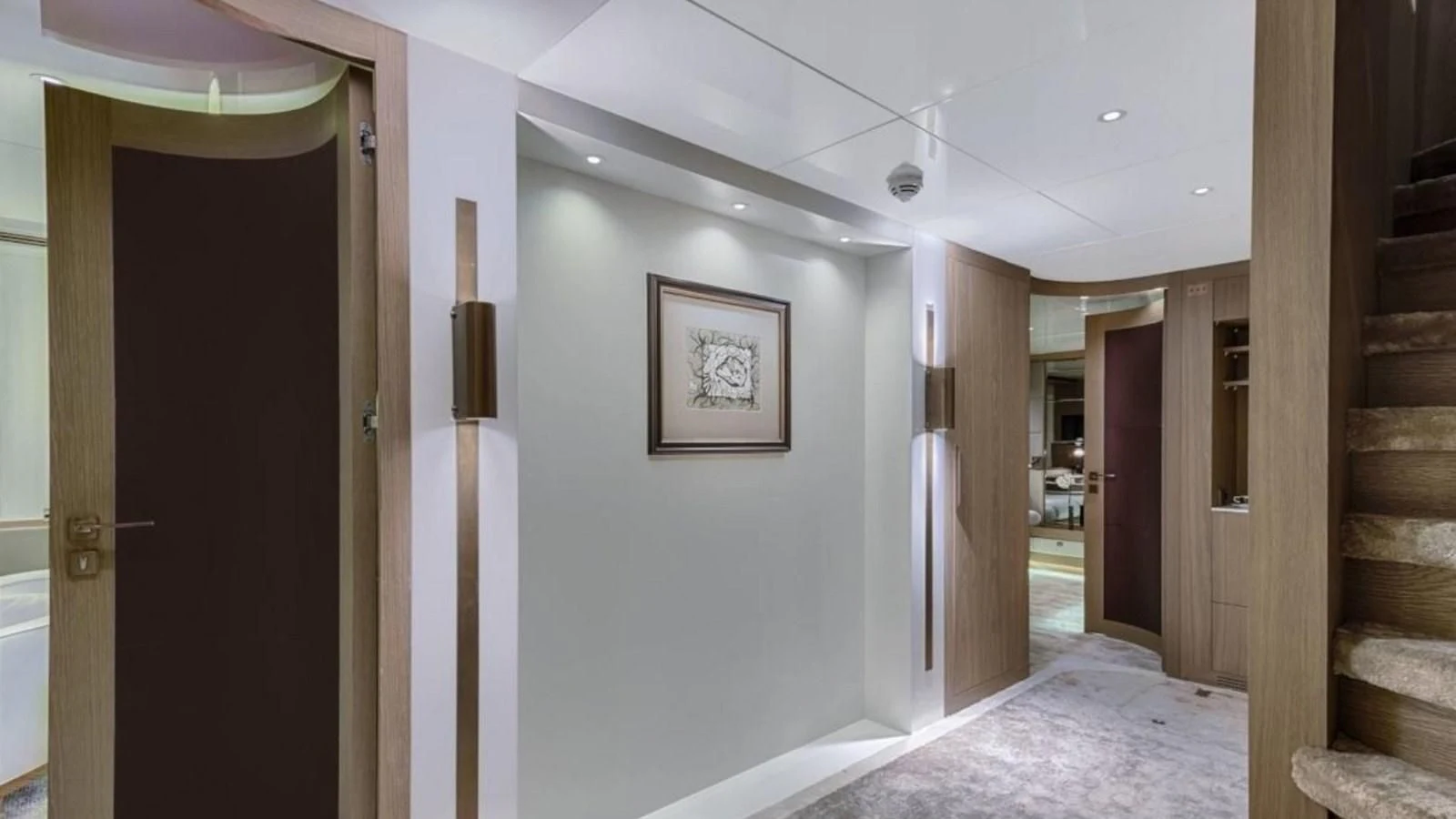 a hallway with a staircase and a staircase aboard M 47 Yacht for Sale