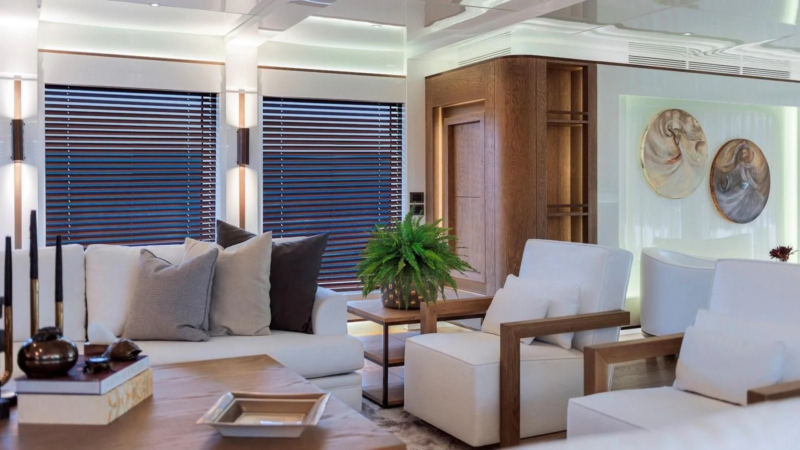 a living room with white couches and a table aboard M 47 Yacht for Sale