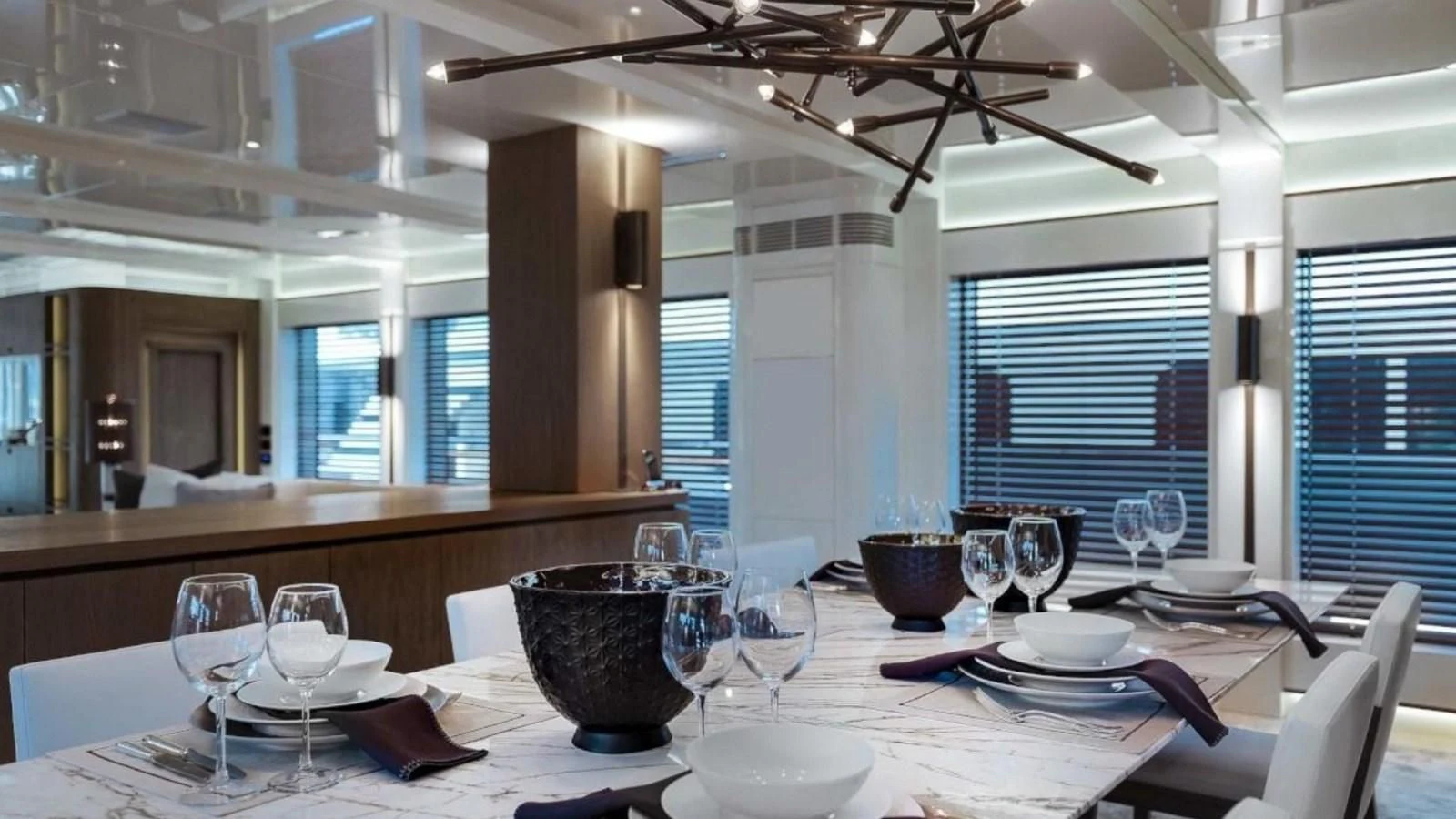a dining room with a table set aboard M 47 Yacht for Sale