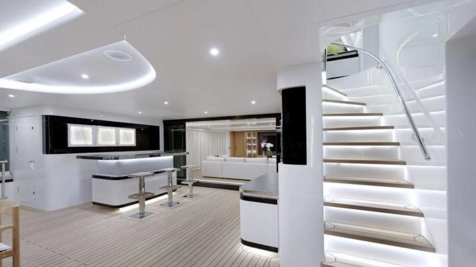 a room with a staircase and a couch aboard M 47 Yacht for Sale