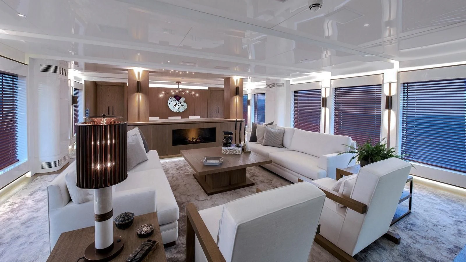 a living room with a fireplace aboard M 47 Yacht for Sale