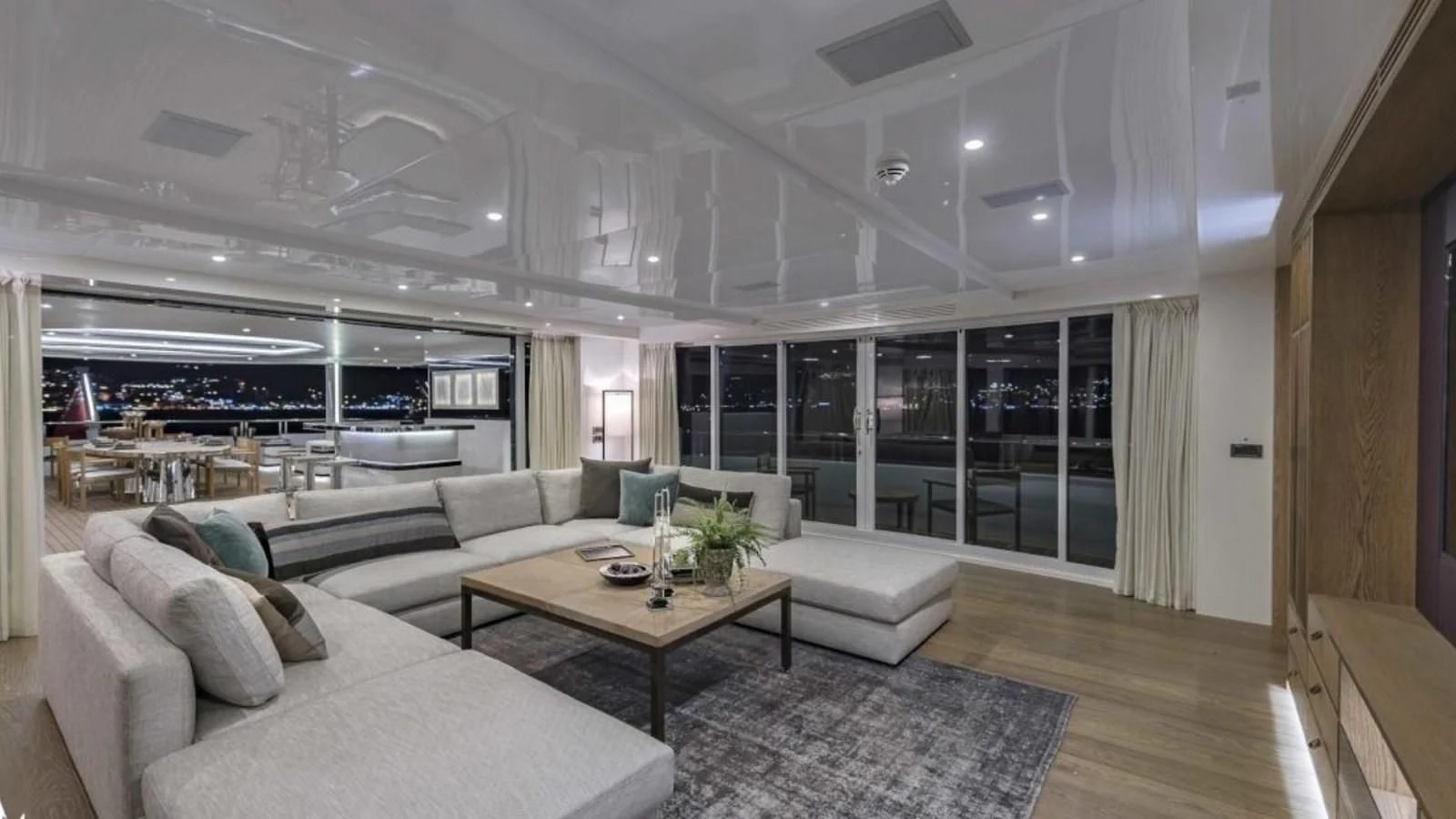 a living room with a large window aboard M 47 Yacht for Sale