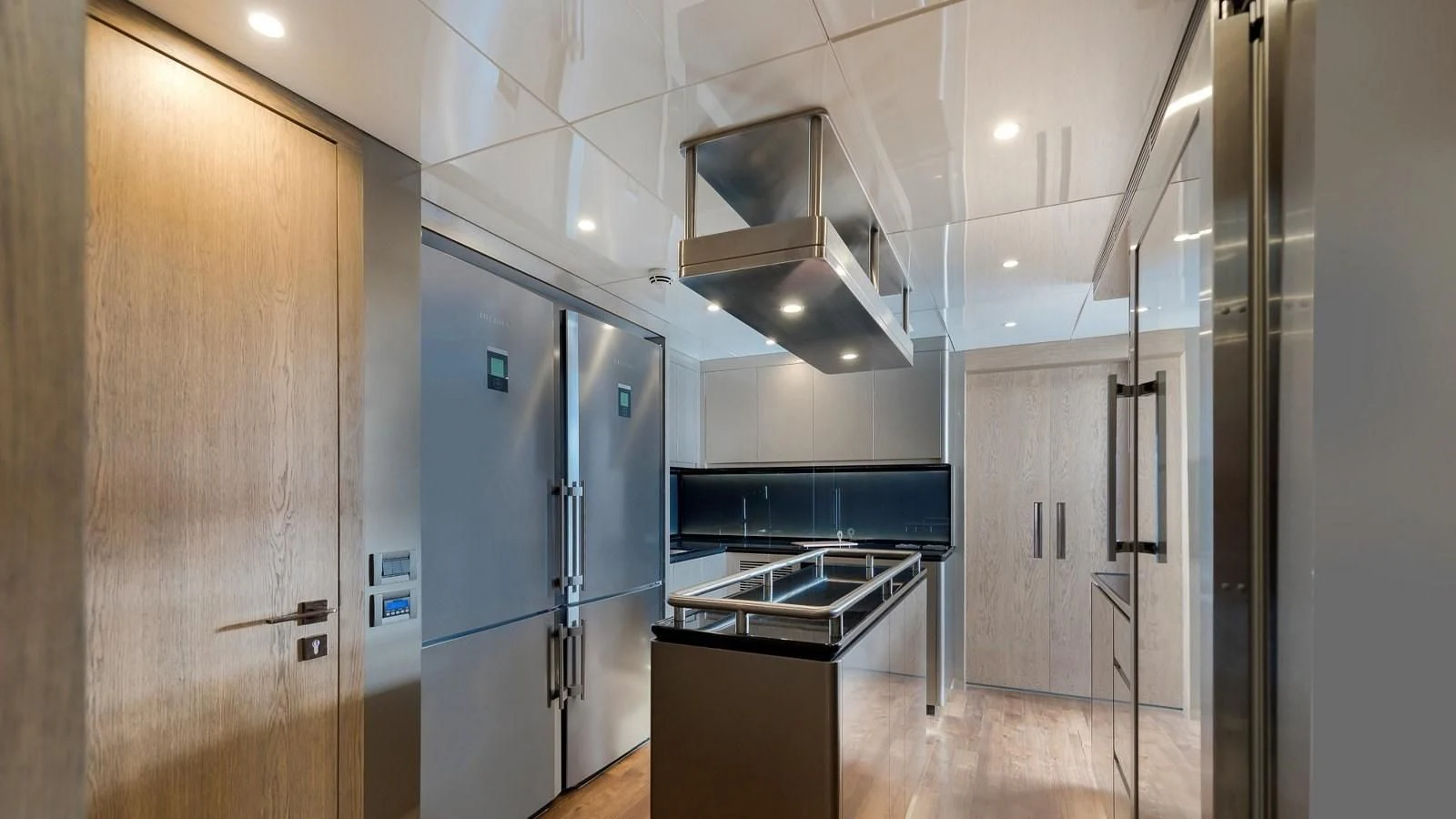 a kitchen with a stainless steel stove aboard M 47 Yacht for Sale