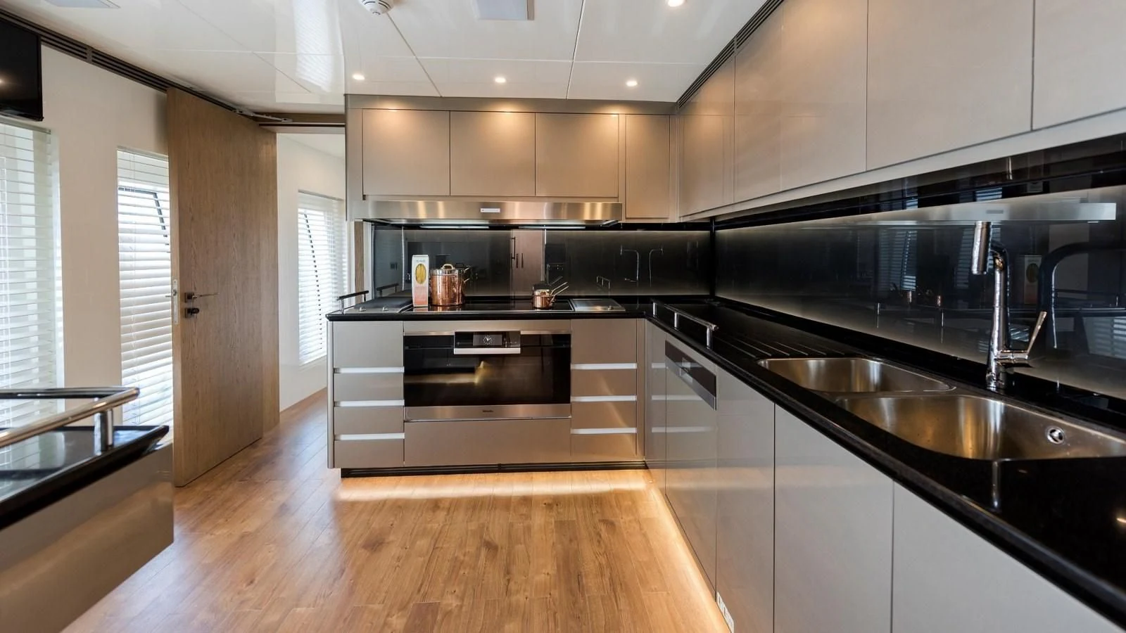 a kitchen with a large island aboard M 47 Yacht for Sale