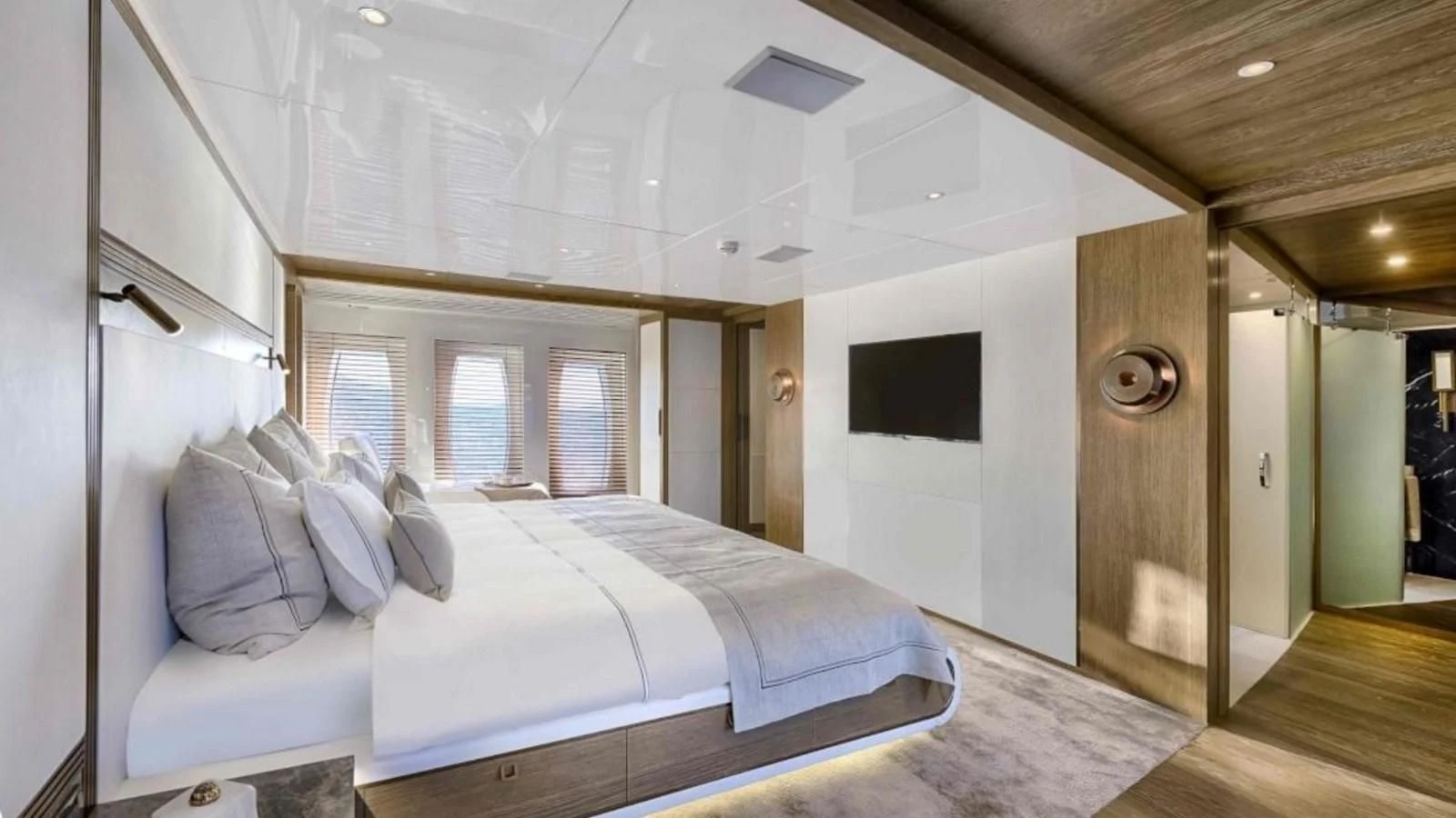 a room with a bed and a television aboard M 47 Yacht for Sale