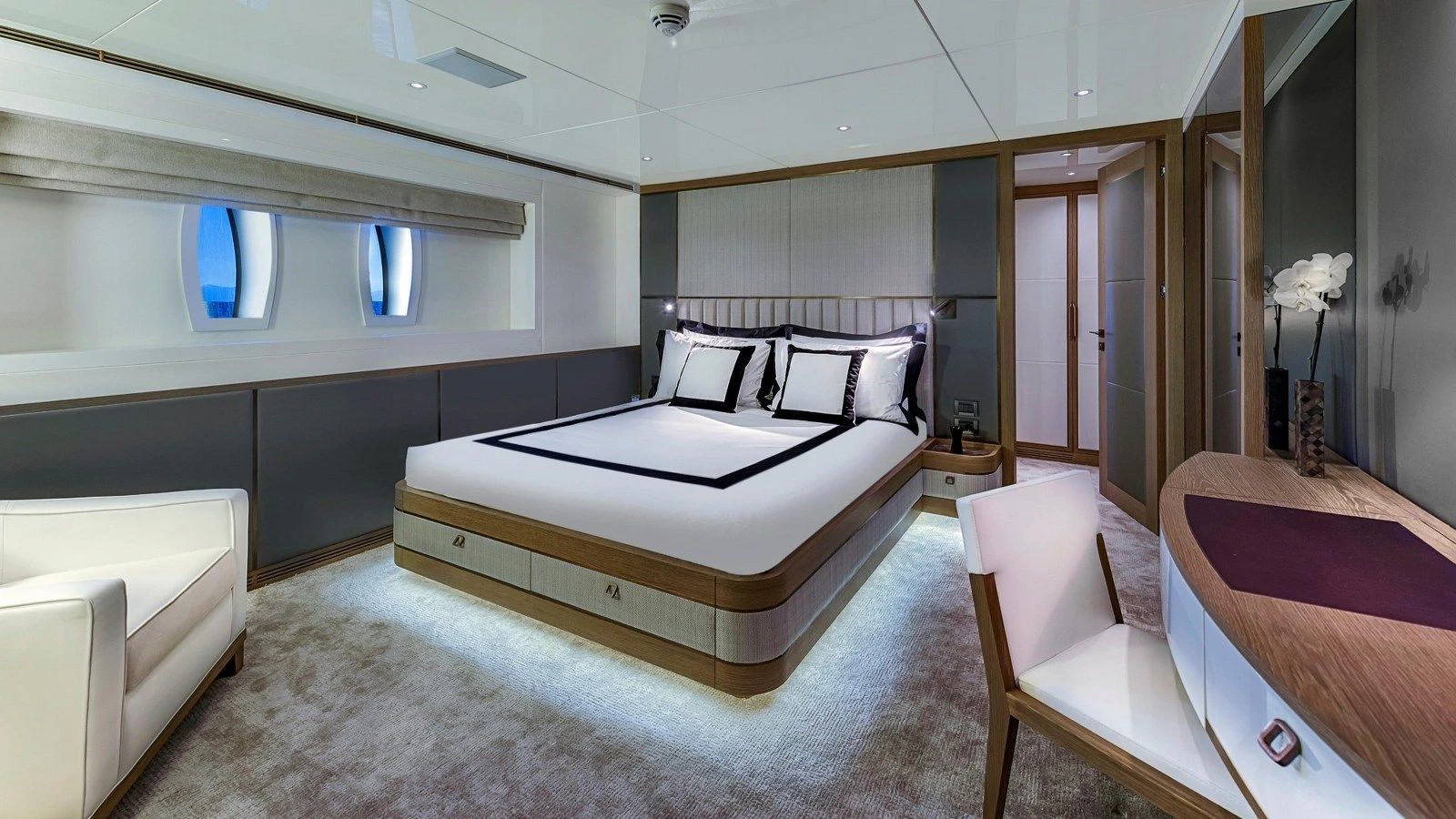 a room with a bed and a chair aboard M 47 Yacht for Sale