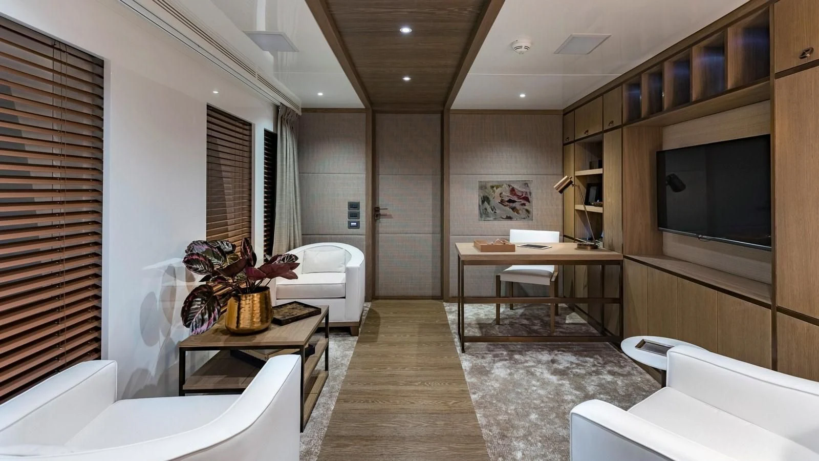 a room with a tv and a table aboard M 47 Yacht for Sale