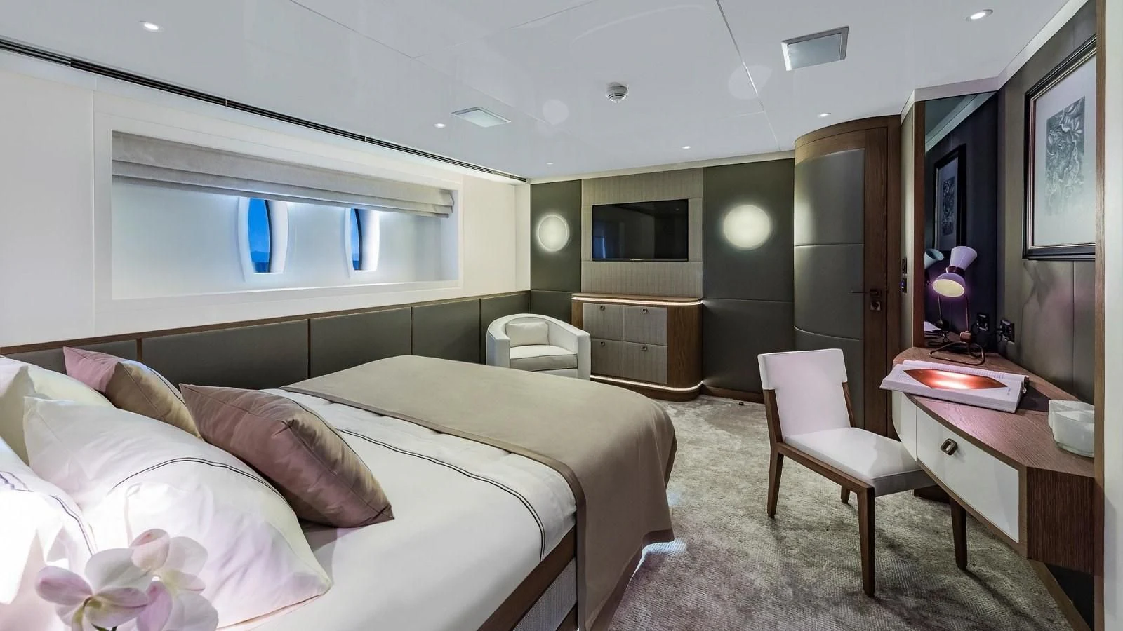 a bedroom with a bed and a desk aboard M 47 Yacht for Sale