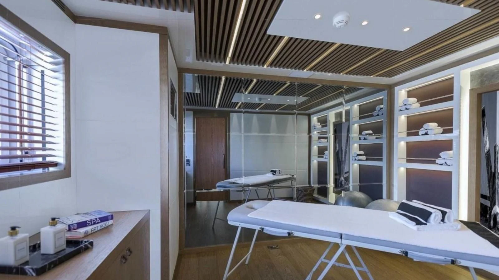 a room with a bed and desk aboard M 47 Yacht for Sale