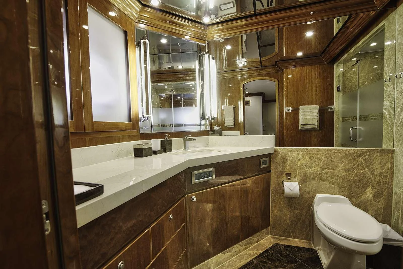 a bathroom with a large mirror aboard STERLING V Yacht for Sale