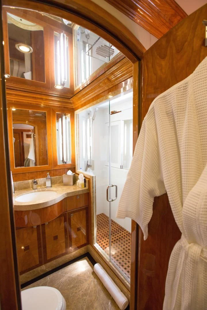 a bathroom with a sink and a mirror aboard STERLING V Yacht for Sale