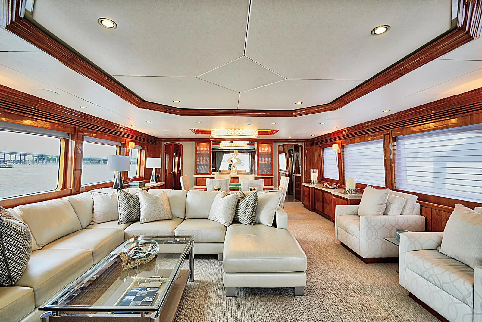 a living room with a couch and a coffee table aboard STERLING V Yacht for Sale