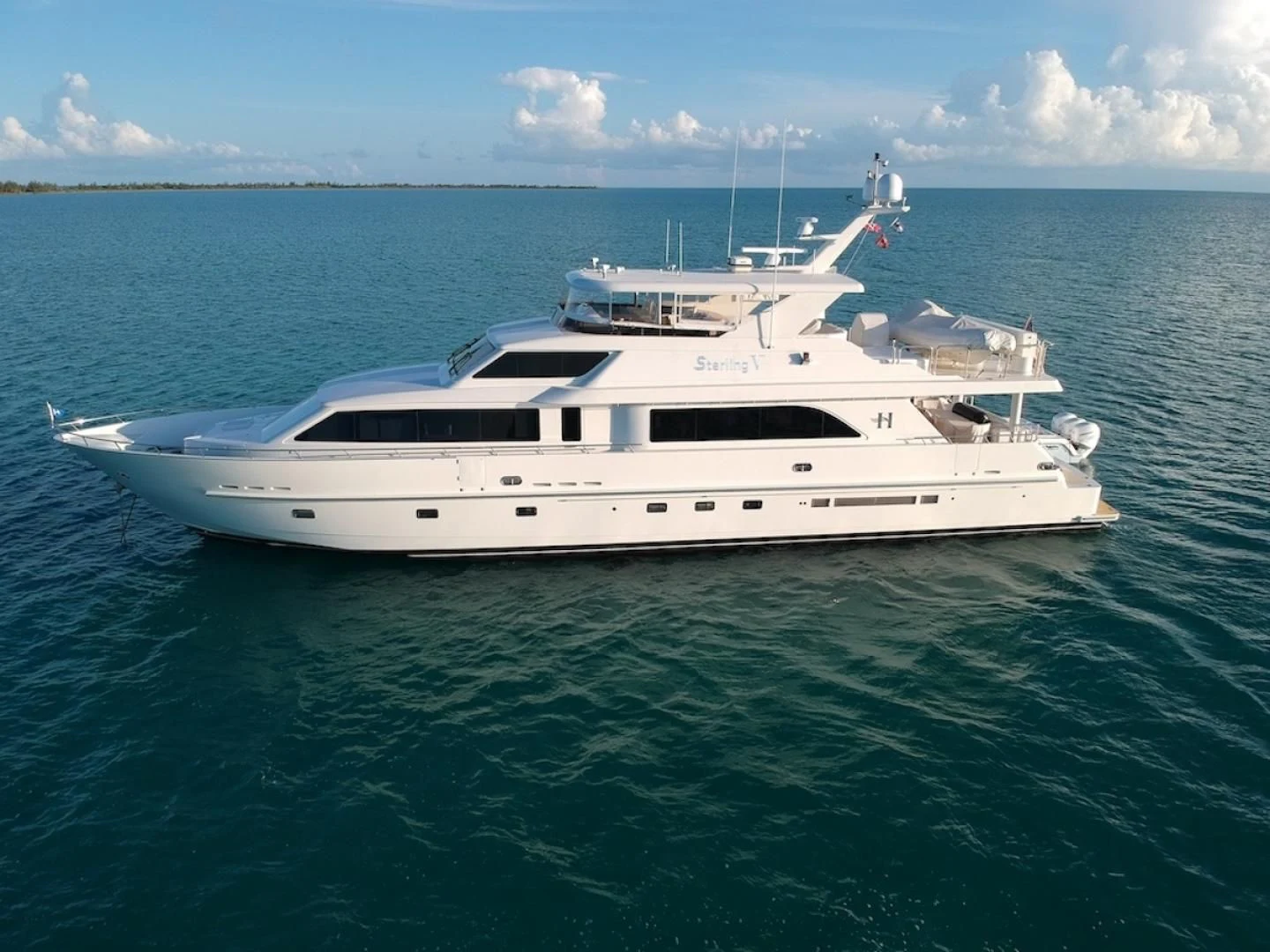 a white yacht in the water aboard STERLING V Yacht for Sale