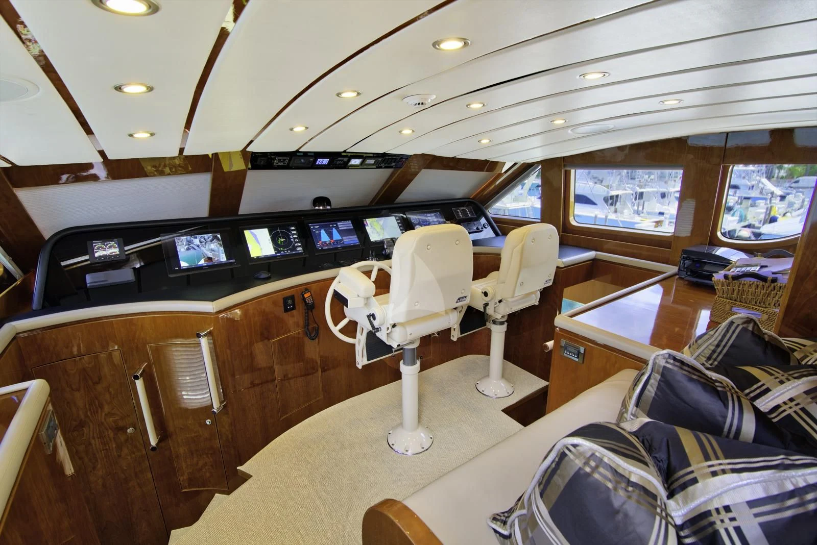 inside of a vehicle with a large screen and a table with chairs and a large window with many aboard STERLING V Yacht for Sale