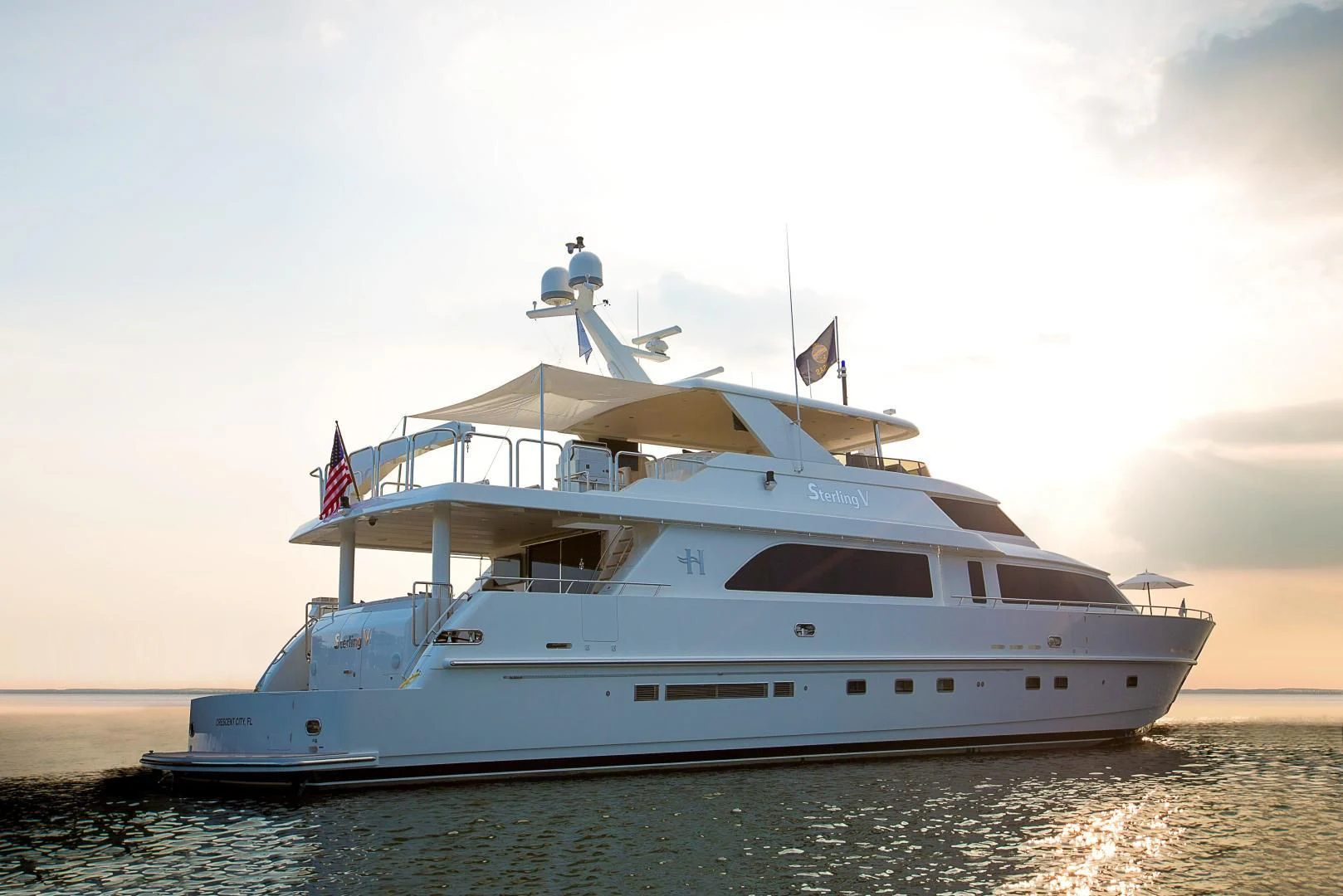 a white yacht on the water aboard STERLING V Yacht for Sale