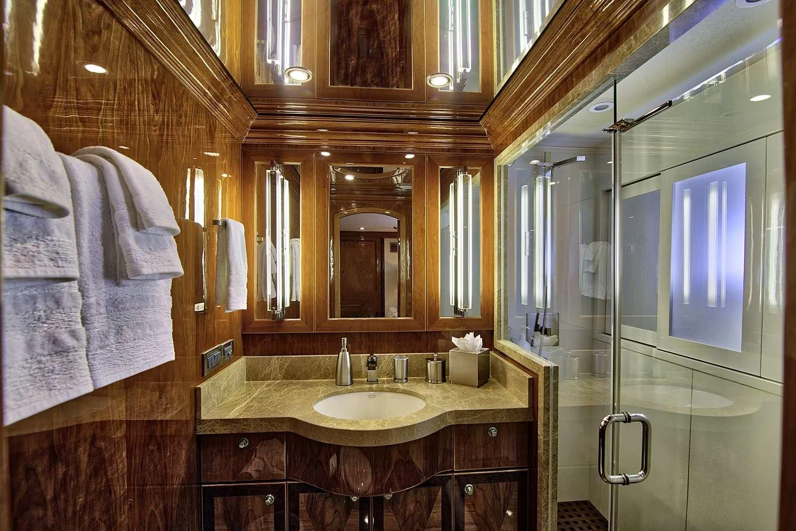 a bathroom with a sink and a mirror aboard STERLING V Yacht for Sale