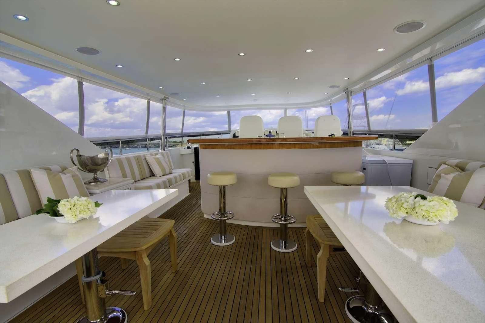 inside of a building with tables and chairs aboard STERLING V Yacht for Sale