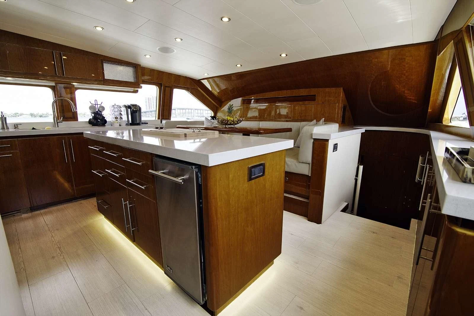a kitchen with wooden cabinets aboard STERLING V Yacht for Sale