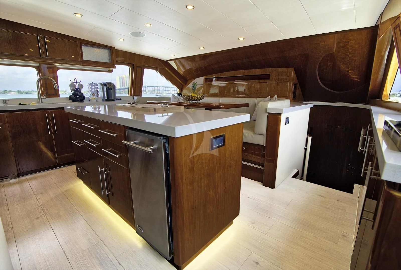 a kitchen with wooden cabinets aboard STERLING V Yacht for Sale