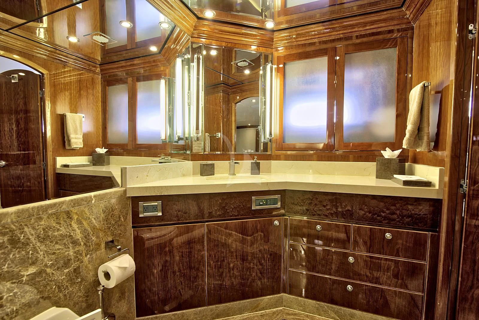 a bathroom with wooden cabinets aboard STERLING V Yacht for Sale