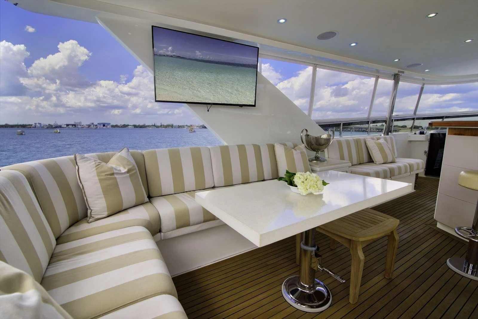 a room with a large window and a large white sofa aboard STERLING V Yacht for Sale