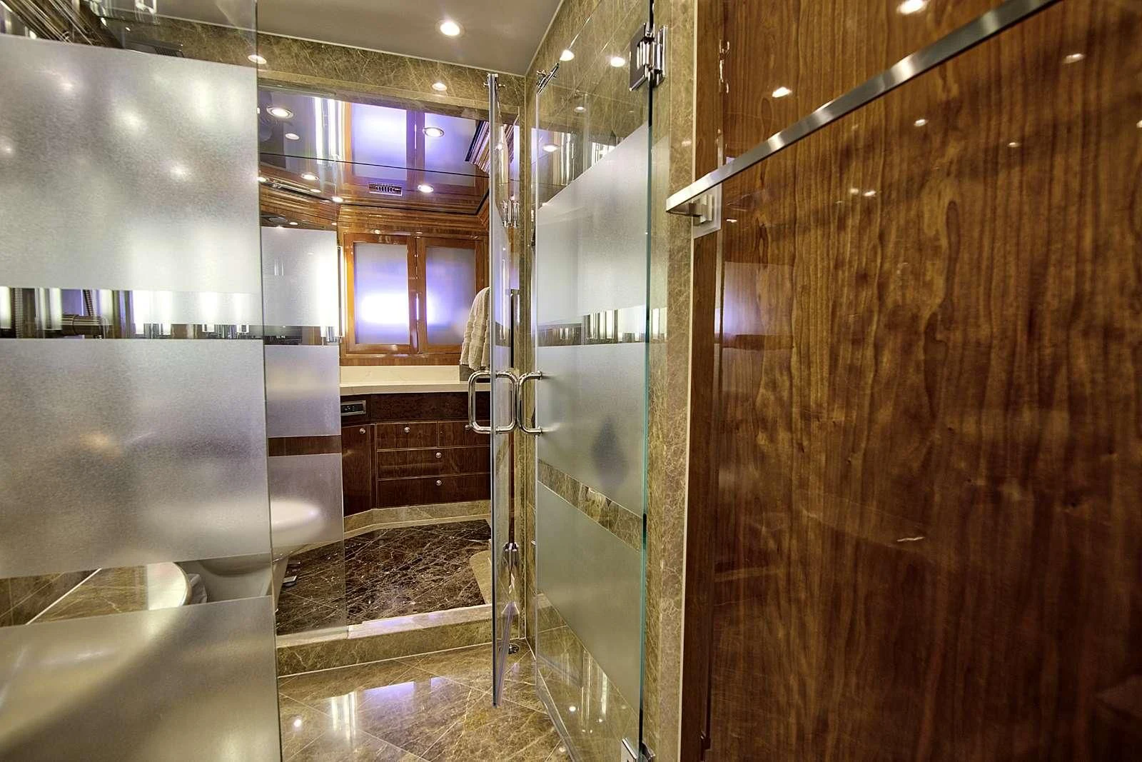 a bathroom with a glass shower aboard STERLING V Yacht for Sale