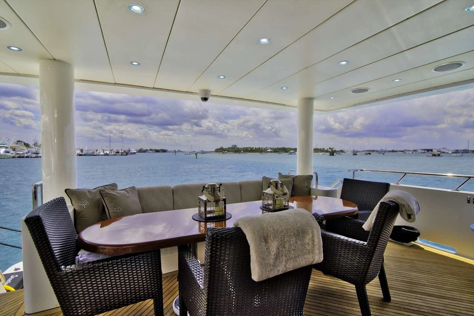 a table and chairs on a deck aboard STERLING V Yacht for Sale
