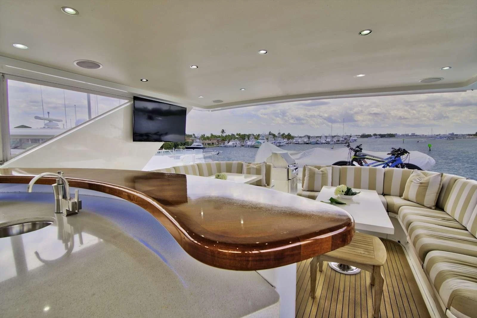 a room with a table and chairs aboard STERLING V Yacht for Sale