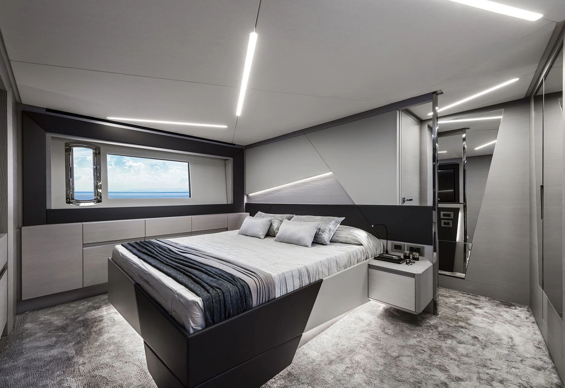 a bedroom with a bed and a desk aboard UNREEL Yacht for Sale
