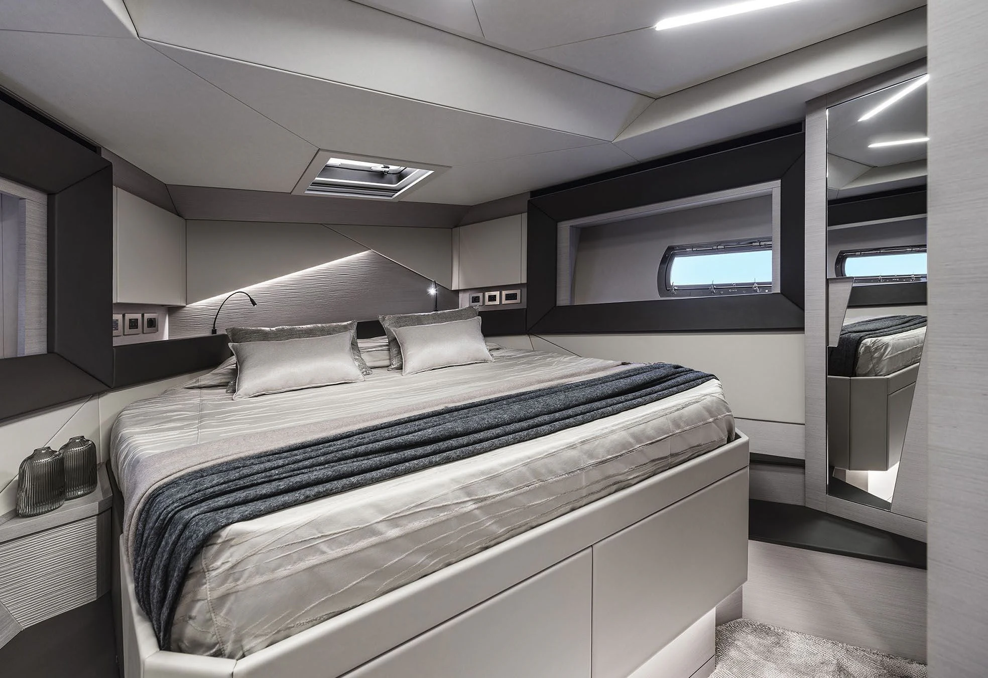 a room with a bed and a desk aboard UNREEL Yacht for Sale