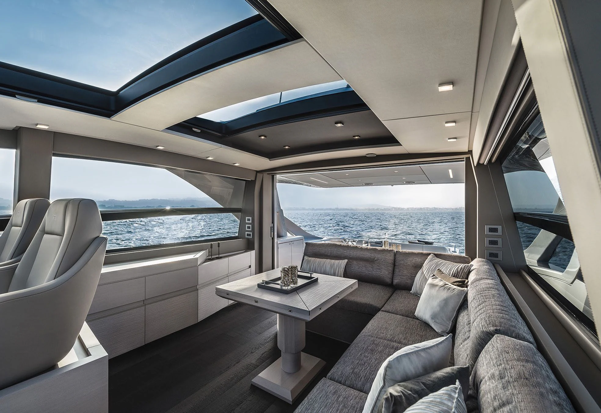 a boat with a table and a couch in it aboard UNREEL Yacht for Sale
