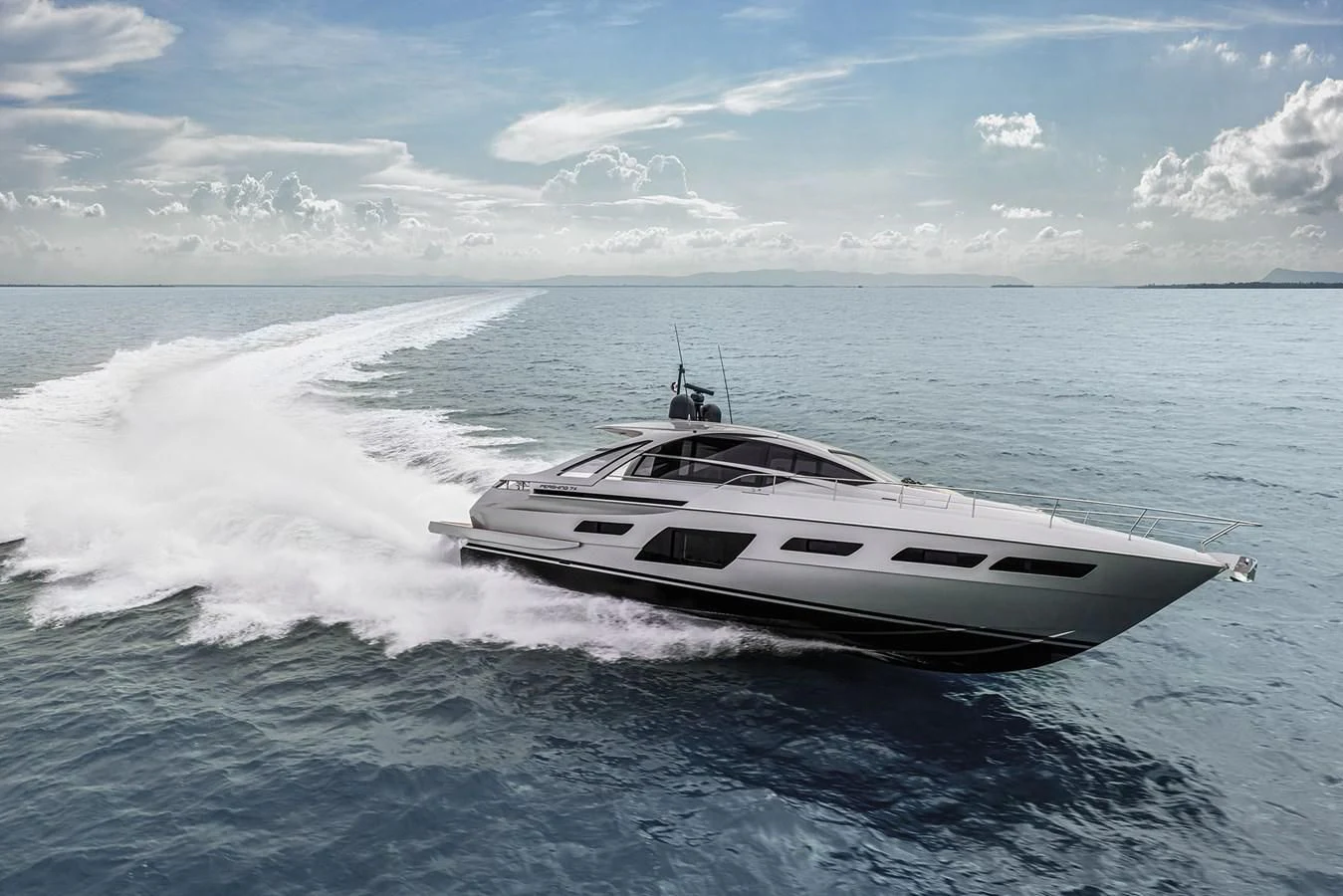 a white boat on the water aboard UNREEL Yacht for Sale